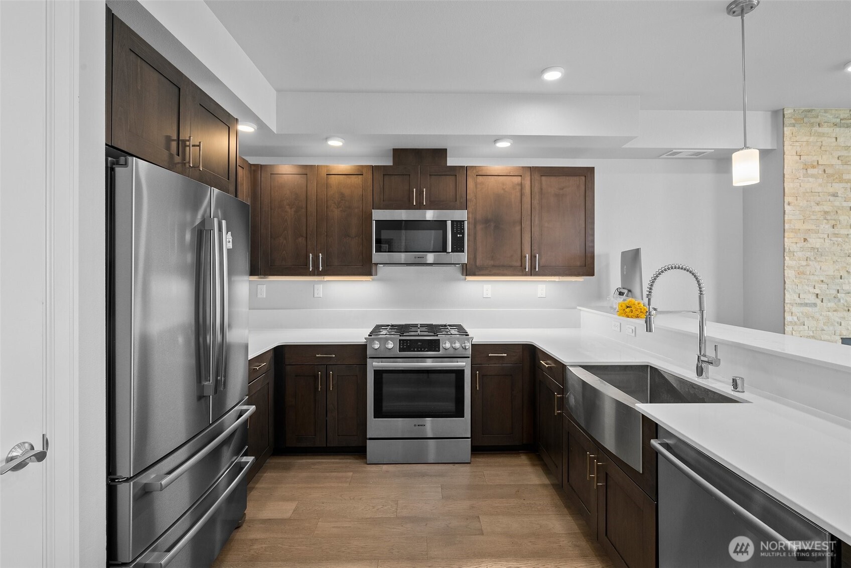 4961 Main Street, Unit 710 Tacoma, WA 98407 - Photo 6 of 24 a kitchen with stainless steel appliances granite countertop a sink stove and refrigerator