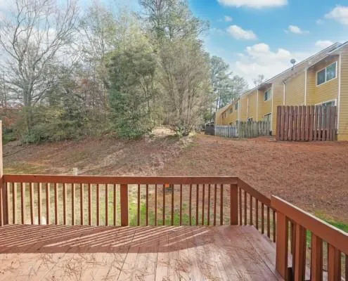 a balcony with trees in front of it