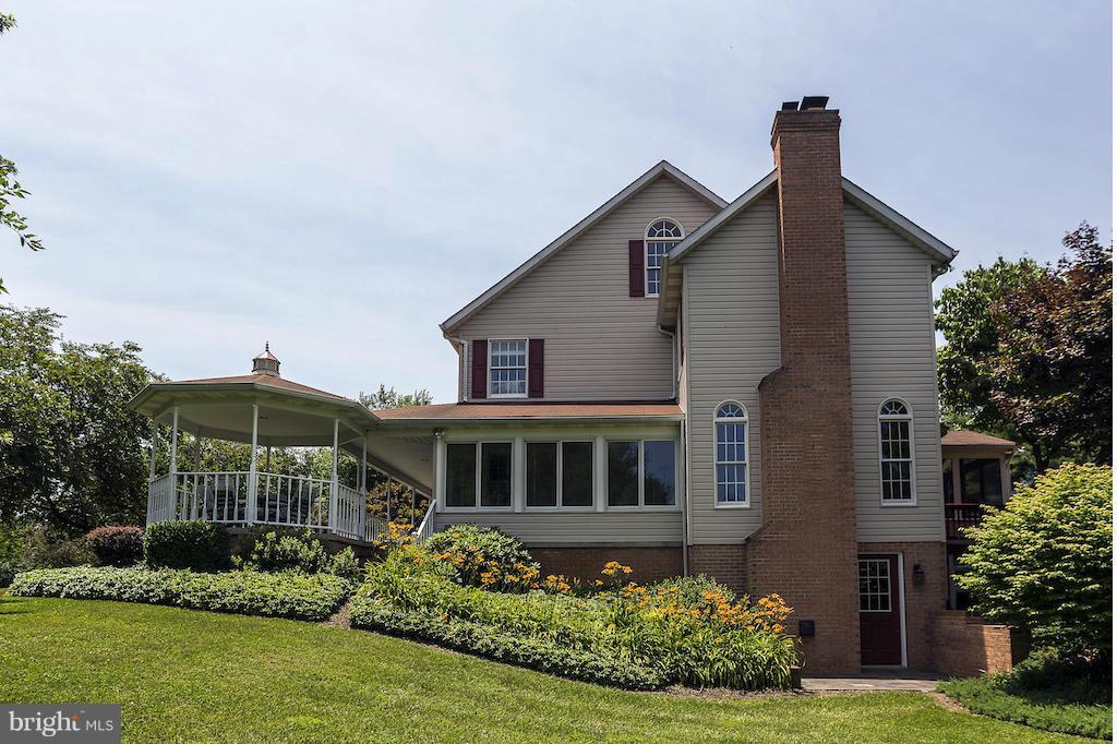 17600 Hardy Road Mount Airy, MD 21771 - Photo 27 of 30 Extensive flowers,walk out to slate tile patio