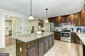 17600 Hardy Road Mount Airy, MD 21771 - Photo 8 of 30 Gourmet Kitchen w/new SS Fridge/Hood/Oven Range