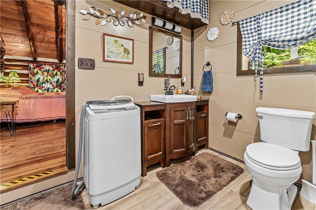 124 New Beaver Creek Road Markleysburg, PA 15459 - Photo 27 of 31 a bathroom with a toilet a sink and a shower