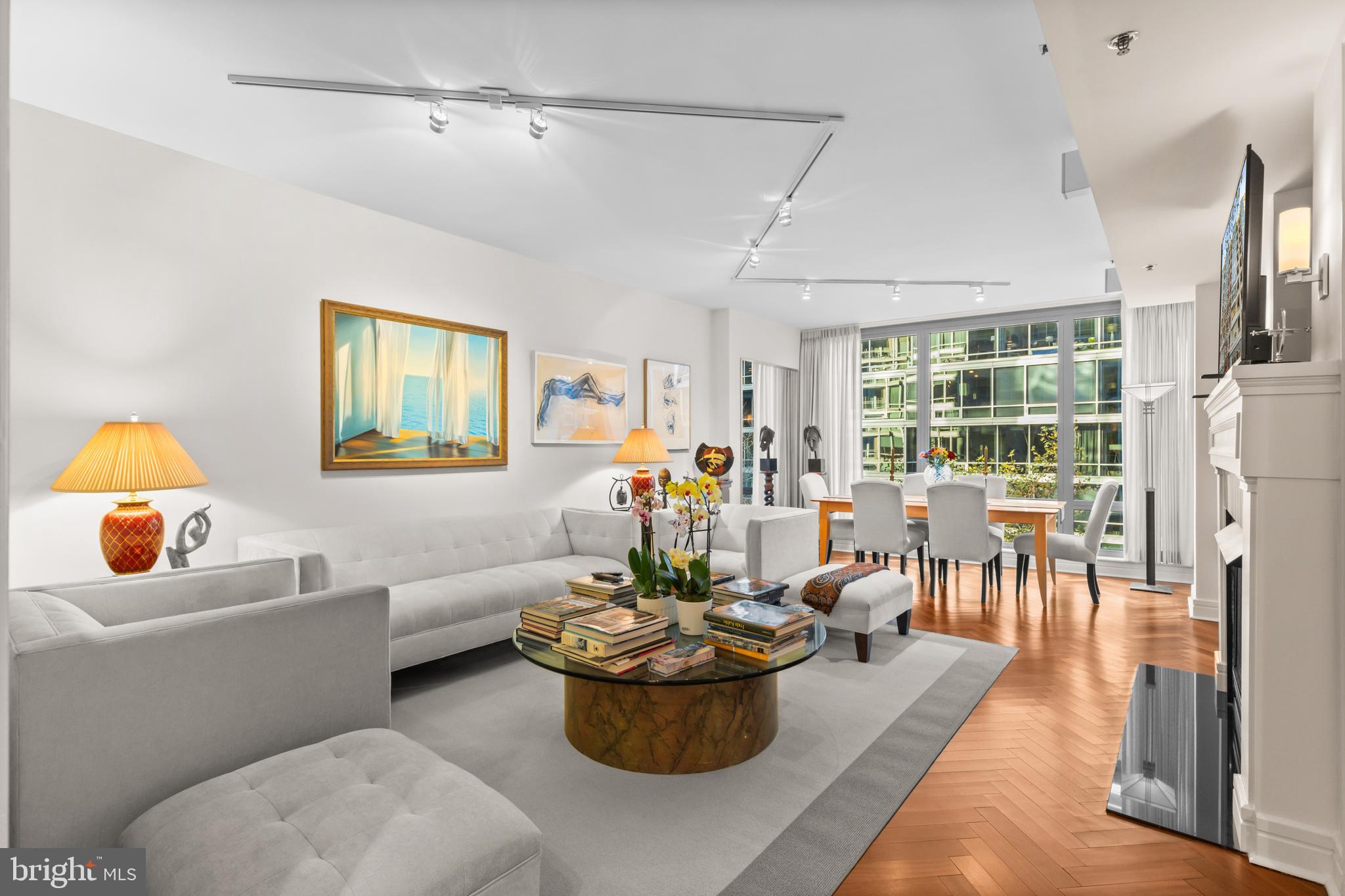 1111 23rd Street Northwest, Unit 4G Washington, DC 20037 - Photo 13 of 35 a living room with furniture and a potted plant
