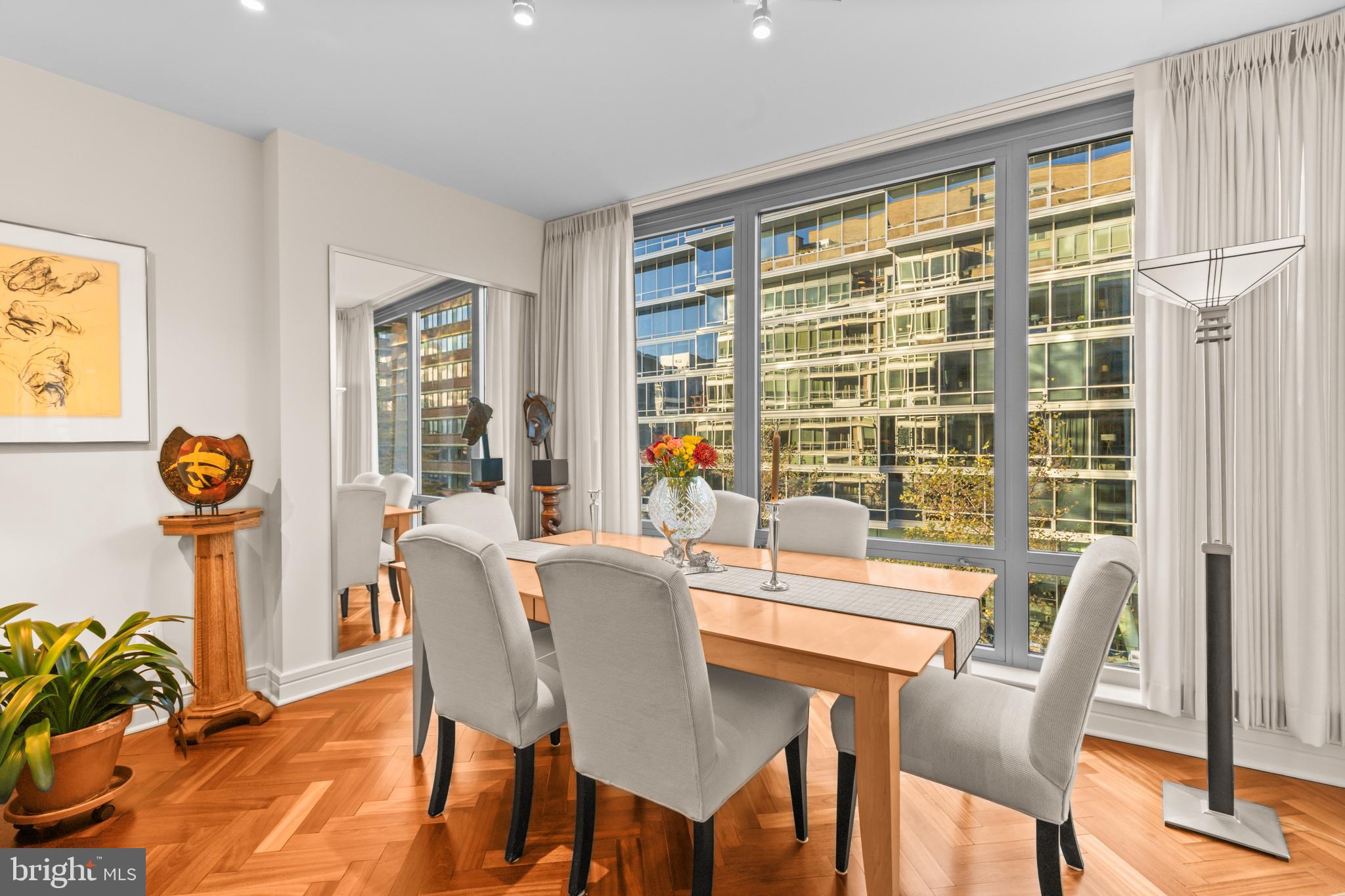 1111 23rd Street Northwest, Unit 4G Washington, DC 20037 - Photo 18 of 35 a view of a dining room with furniture window and outside view