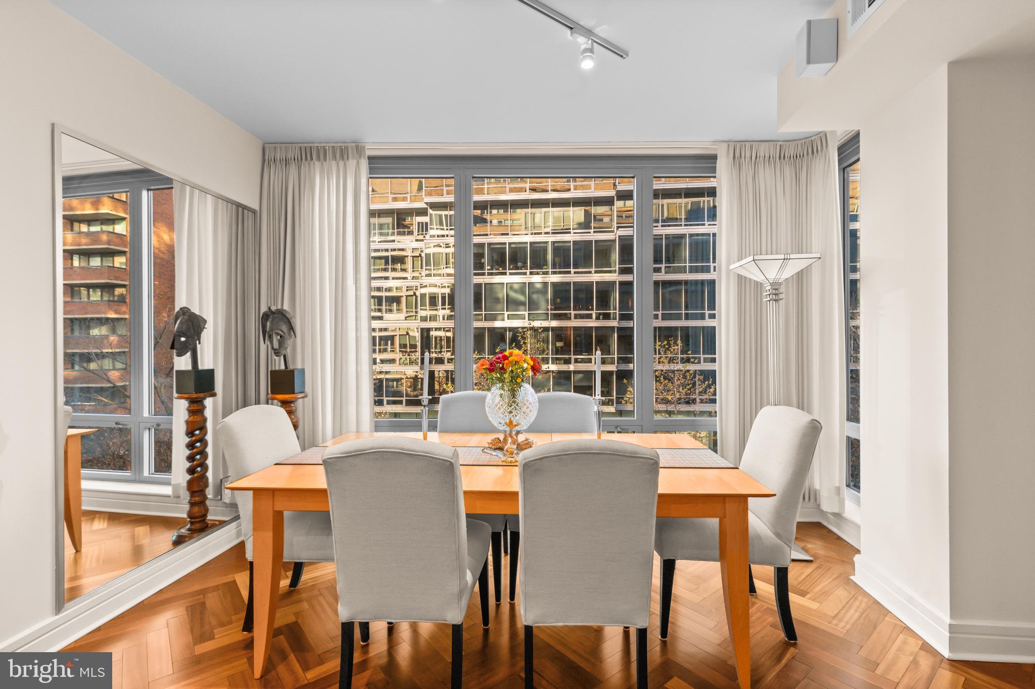 1111 23rd Street Northwest, Unit 4G Washington, DC 20037 - Photo 19 of 35 a dining room with furniture and a large window