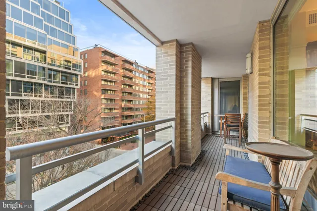 a view of a balcony with chair and table