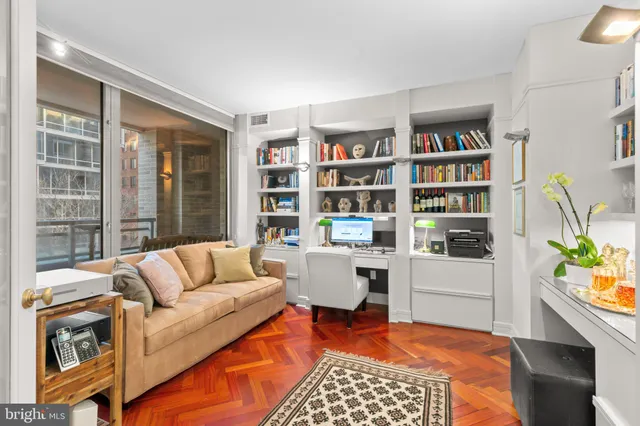a living room with furniture and a rug