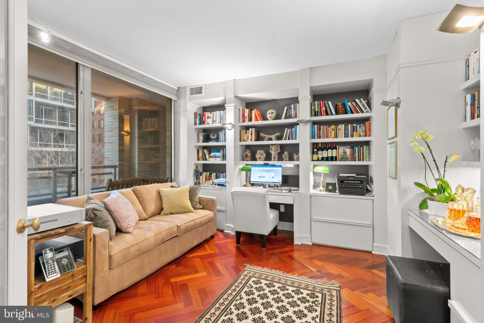 1111 23rd Street Northwest, Unit 4G Washington, DC 20037 - Photo 23 of 35 a living room with furniture and a rug