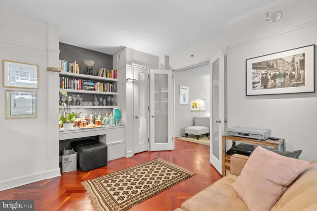 a bed room with a bed and a book shelf