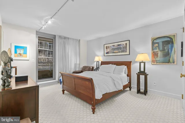 a bed room with a bed and a chair