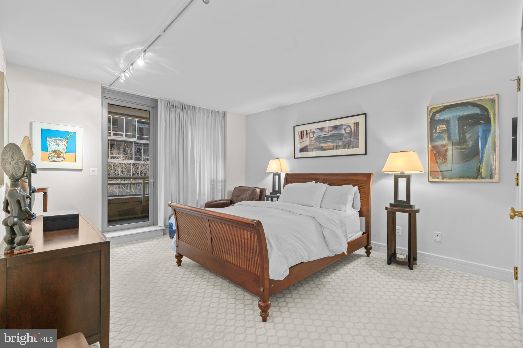 1111 23rd Street Northwest, Unit 4G Washington, DC 20037 - Photo 29 of 35 a bed room with a bed and a chair