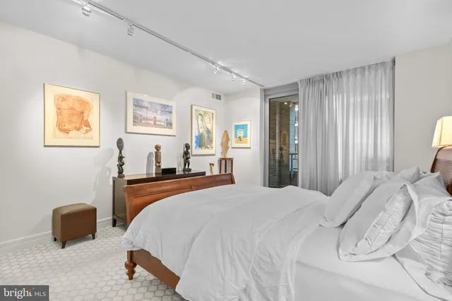 a bedroom with bed and window