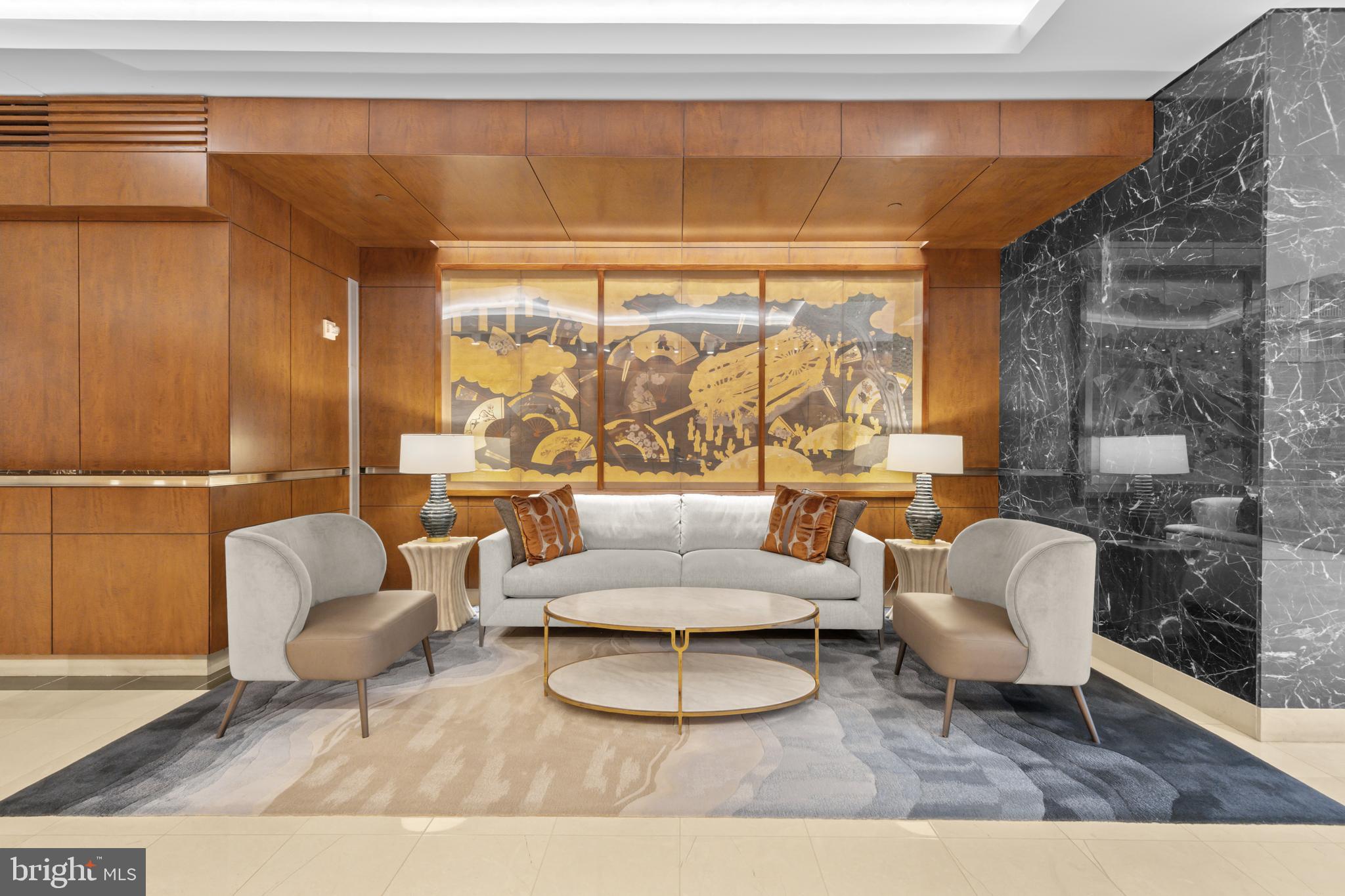 1111 23rd Street Northwest, Unit 4G Washington, DC 20037 - Photo 3 of 35 a living room with furniture and a floor to ceiling window