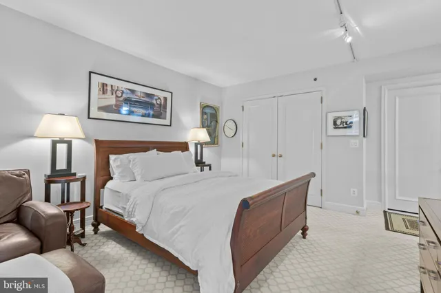 a bedroom with a bed and a lamp