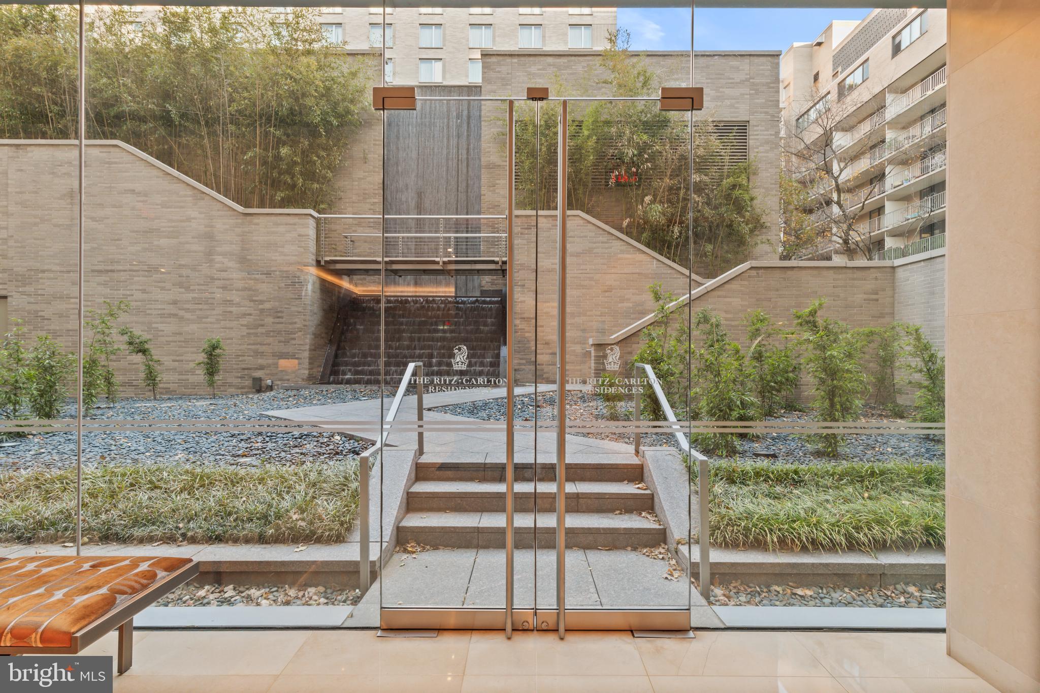 1111 23rd Street Northwest, Unit 4G Washington, DC 20037 - Photo 34 of 35 front view of a house with a yard