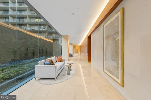 a view of a balcony with couch and wooden floor