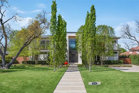 a front view of a building with garden