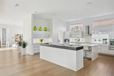 a kitchen with a sink and cabinets