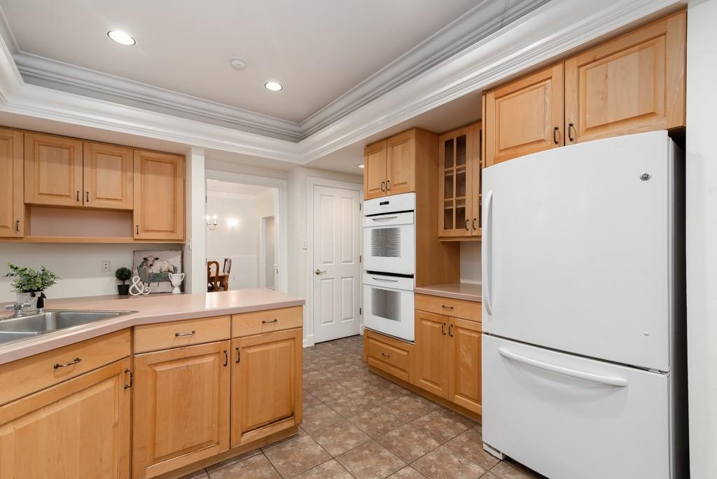 156 West Cruikshank Road Butler, PA 16002 - Photo 13 of 25 a kitchen with a refrigerator and a sink