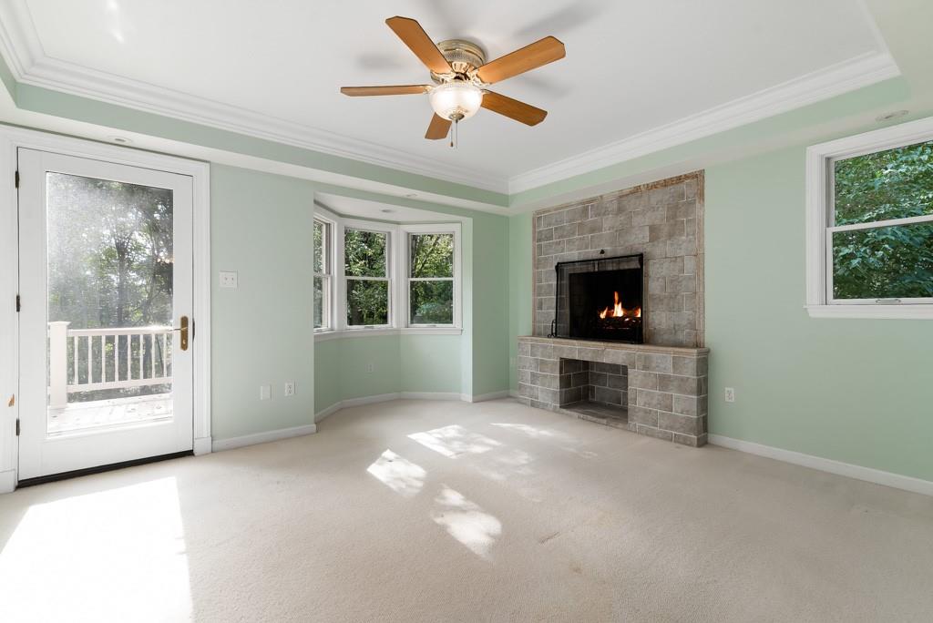156 West Cruikshank Road Butler, PA 16002 - Photo 17 of 25 a view of a livingroom with a flat screen tv ceiling fan and windows