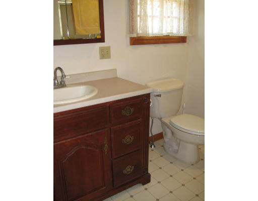 5 Freeman Road Chelmsford, MA 01824 - Photo 19 of 21 a bathroom with a sink a toilet and mirror