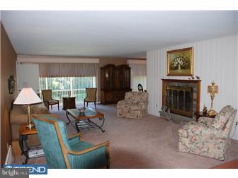 1411 Clements Road Wyncote, PA 19095 - Photo 2 of 12 a living room with furniture and a fireplace