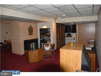 1411 Clements Road Wyncote, PA 19095 - Photo 11 of 12 a room with furniture and flat screen tv