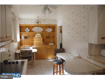 1411 Clements Road Wyncote, PA 19095 - Photo 5 of 12 a bathroom with a sink and a mirror
