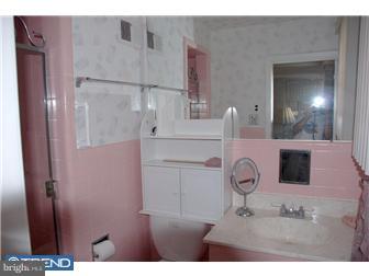 1411 Clements Road Wyncote, PA 19095 - Photo 9 of 12 a bathroom with a sink and mirror
