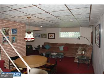 1411 Clements Road Wyncote, PA 19095 - Photo 10 of 12 a living room with furniture and a chandelier