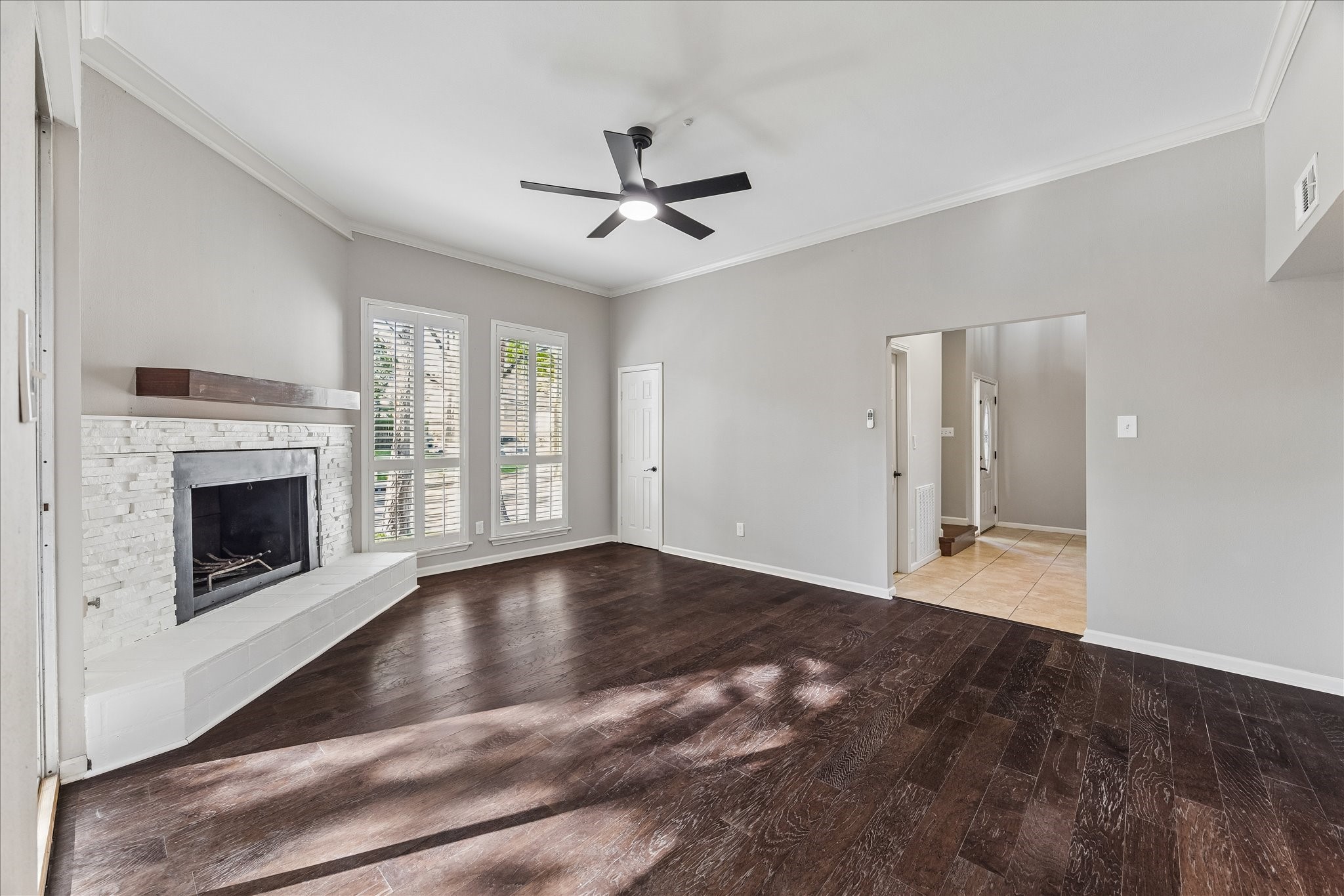 15066 Kimberley Court Houston, TX 77079 - Photo 12 of 27 The living room opens to the kitchen and connects to both the breakfast room and foyer. Tall windows omplemented by classic shutters add charm and privacy while allowing natural light to filter through.
