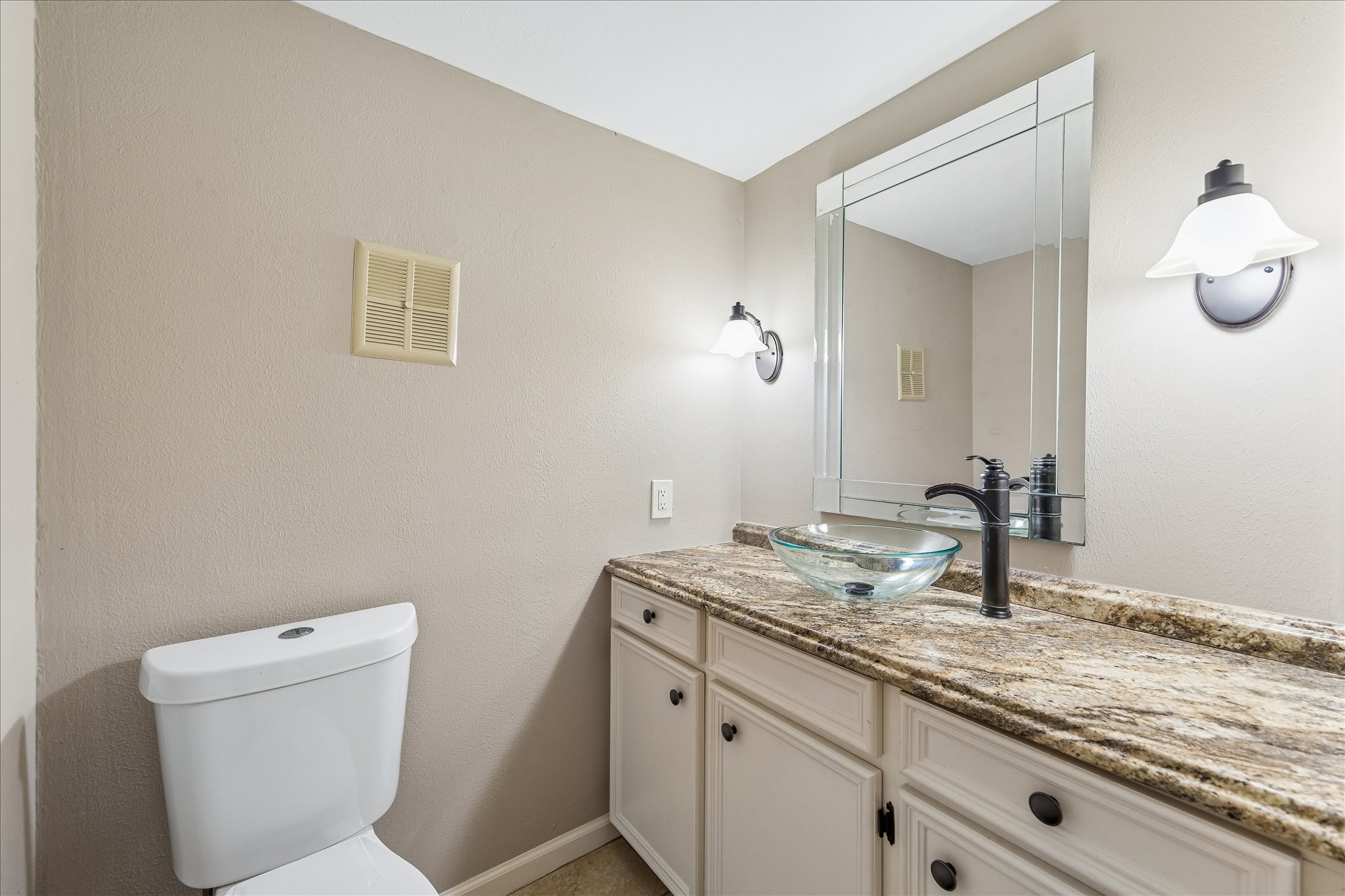 15066 Kimberley Court Houston, TX 77079 - Photo 13 of 27 Stylish powder room off the foyer wiith elegant finishes, convenient and tasteful space for guests.