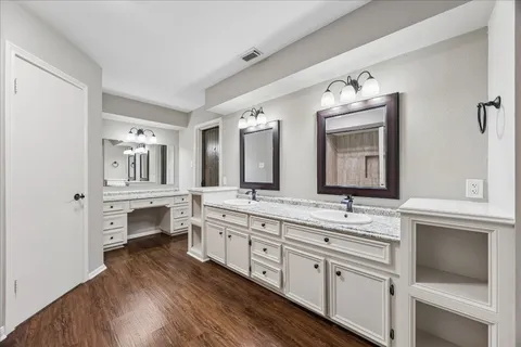 an empty room with a ceiling fan and window