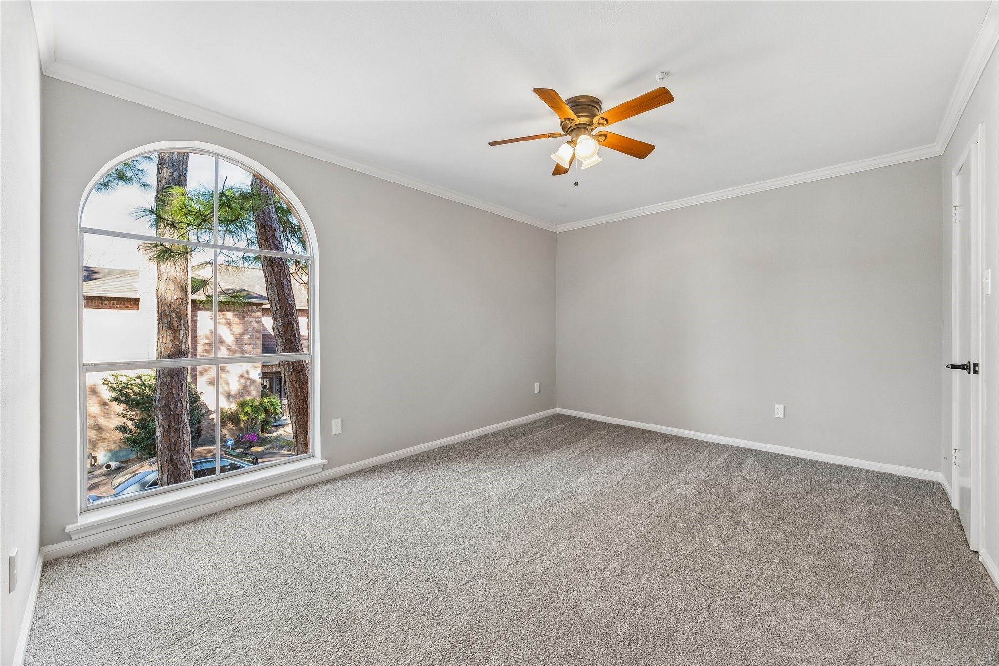 15066 Kimberley Court Houston, TX 77079 - Photo 22 of 27 This bright and airy bedroom features a classic arched window and the added convenience of dual closets for ample storage.