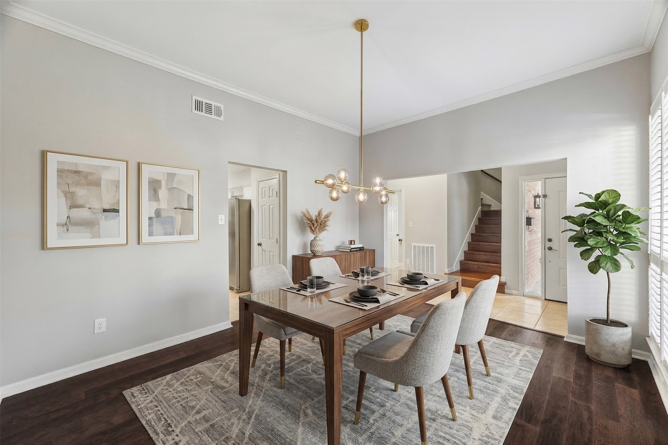 15066 Kimberley Court Houston, TX 77079 - Photo 3 of 27 Just off the two story entry is the formal dining area featuring a large window with plantation shutters and an updated statement chandelier, creating an elegant space ideal for memorable gatherings. Design allows for seamless flow into the kitchen and living areas, perfect for both everyday meals and entertaining. *Photo has been virtually staged.