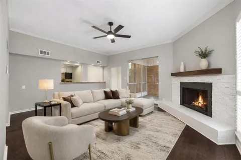 a kitchen with granite countertop a refrigerator and a stove top oven