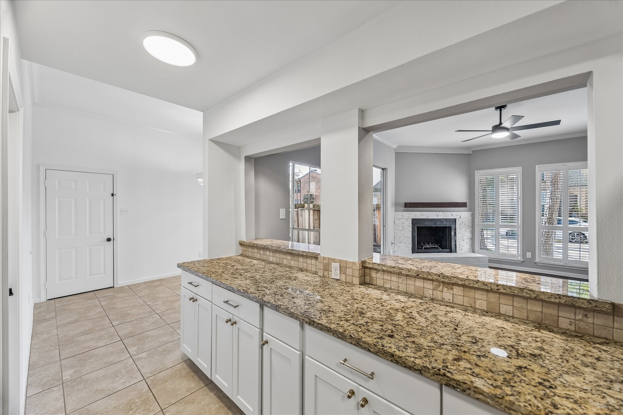 15066 Kimberley Court Houston, TX 77079 - Photo 8 of 27 Extra counter space overlooking the living space and opening to the breakfast room, offering both convenience and functionality.