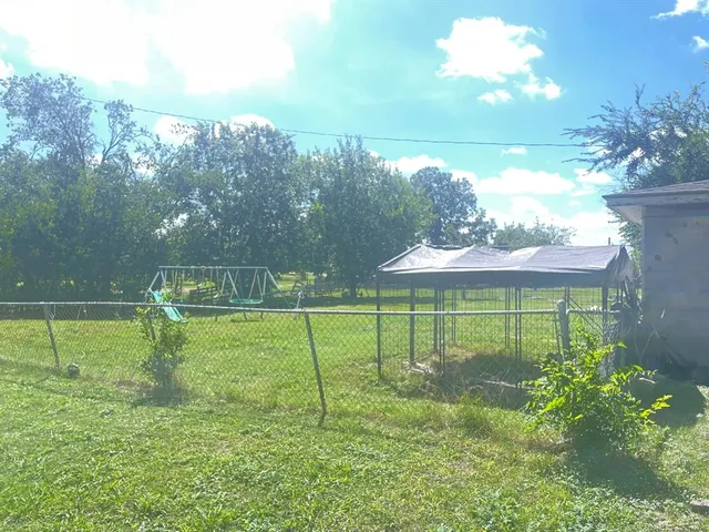 a view of a golf course with a lake view