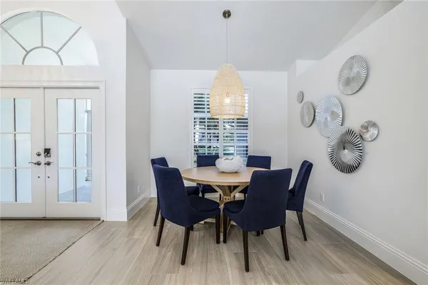 a view of a dining room with furniture and window