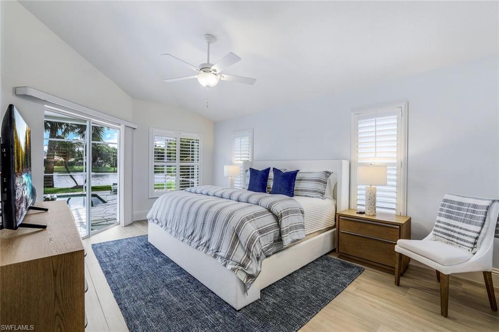 914 Marble Drive Naples, FL 34104 - Photo 15 of 50 a bed room with a bed and a couch