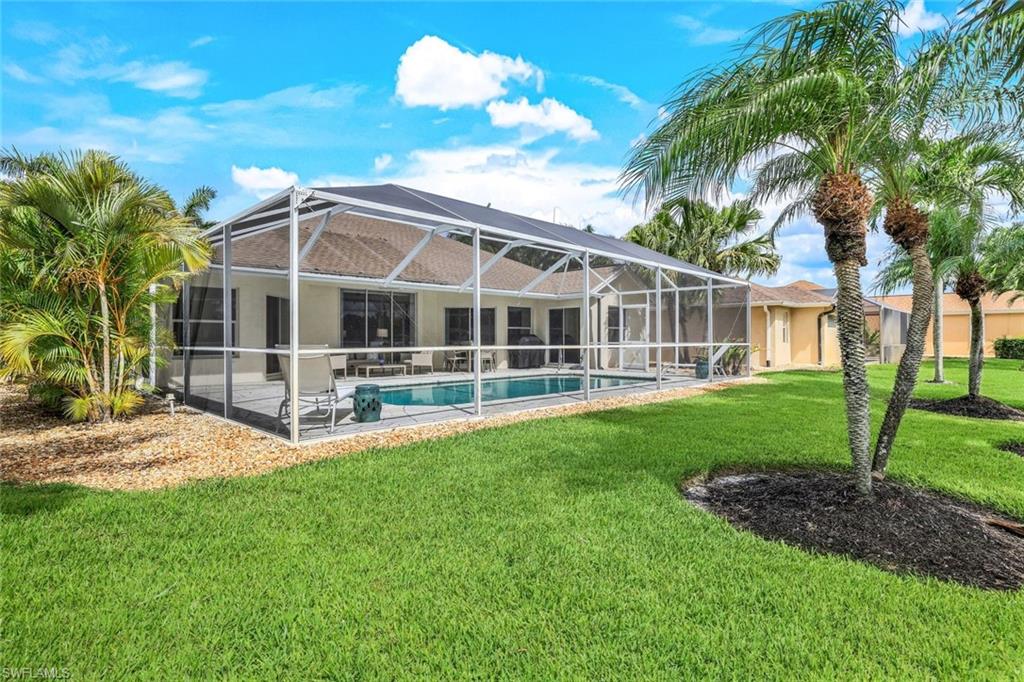 914 Marble Drive Naples, FL 34104 - Photo 33 of 50 a view of a house with a yard and sitting area