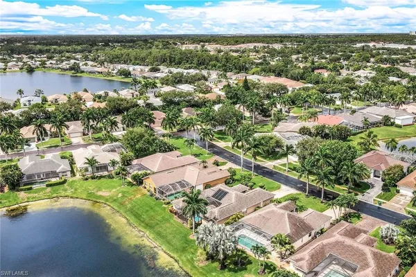 an aerial view of residential houses with outdoor space