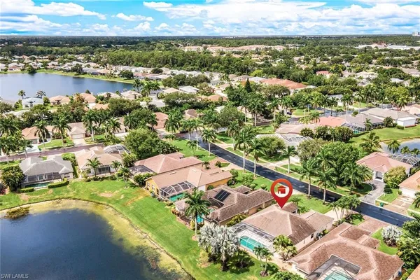 an aerial view of residential houses with outdoor space