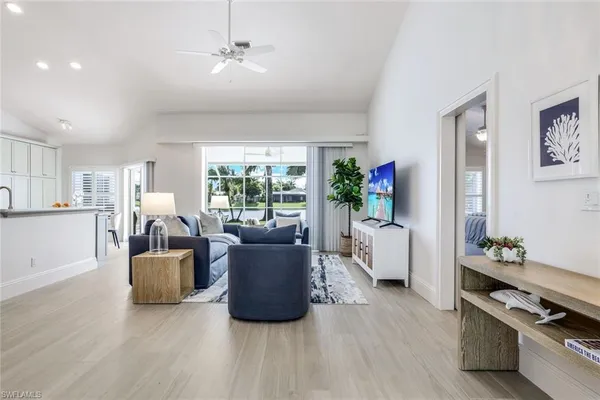 a living room with furniture and a window
