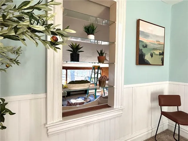 a view of living room with furniture and wooden floor