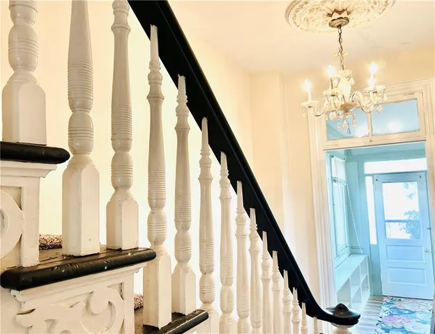 a view of a living room with a fireplace