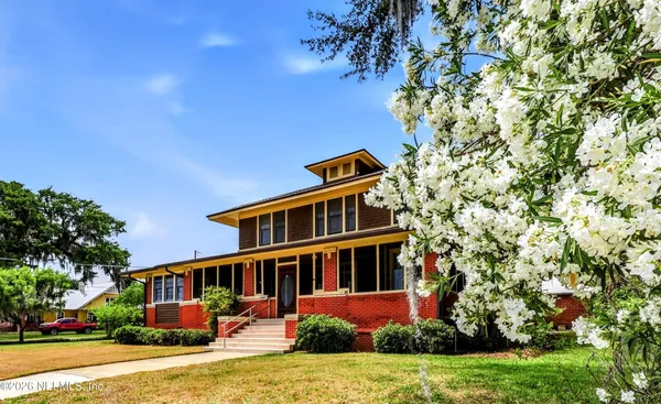 front view of a house with a yard