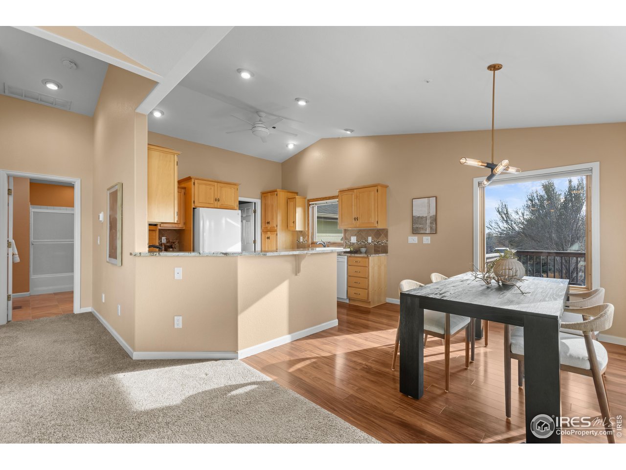 3308 Innisfree Lane Laporte, CO 80535 - Photo 14 of 50 a living room with kitchen island furniture and a wooden floor