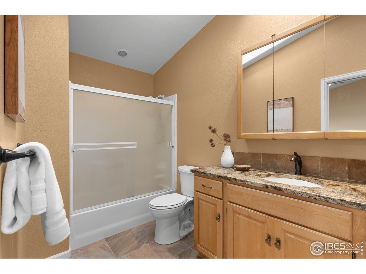 3308 Innisfree Lane Laporte, CO 80535 - Photo 40 of 50 a bathroom with a granite countertop sink toilet and shower