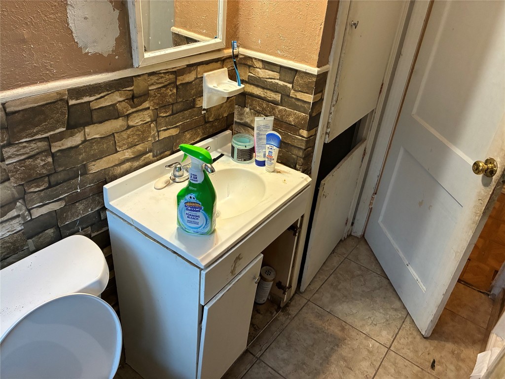 5404 Starling Street Houston, TX 77017 - Photo 13 of 21 a bathroom with a sink a toilet and shower