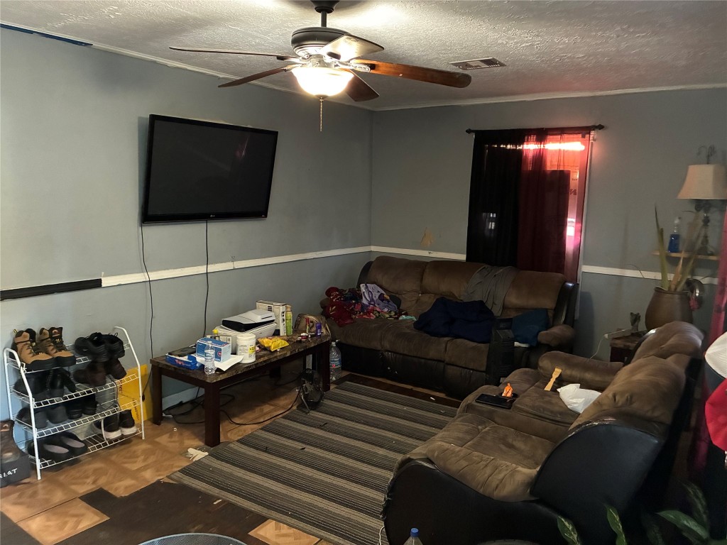 5404 Starling Street Houston, TX 77017 - Photo 3 of 21 a living room with furniture and a flat screen tv